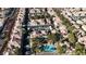 Bird's eye view of a community featuring a pool, trees, landscaping, and ample parking at 251 S Green Valley Pkwy # 1212, Henderson, NV 89012