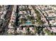 Aerial view of a neighborhood showcasing a community pool surrounded by lush landscaping at 251 S Green Valley Pkwy # 1212, Henderson, NV 89012