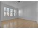 Bright bedroom featuring hardwood floors and windows with plantation shutters at 251 S Green Valley Pkwy # 1212, Henderson, NV 89012