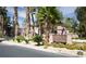 Inviting entrance to the Bella Vista condominiums, showcasing lush landscaping and the community sign at 251 S Green Valley Pkwy # 1212, Henderson, NV 89012