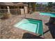 Inviting community hot tub with brick surround, perfect for relaxation and leisure in a well-maintained setting at 251 S Green Valley Pkwy # 1212, Henderson, NV 89012