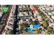 Overhead view of a community pool, featuring a shaded cabana, lounge chairs, and lush palm trees at 251 S Green Valley Pkwy # 1212, Henderson, NV 89012