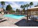 Well-maintained community pool, providing a refreshing and enjoyable experience for residents with tables and chairs at 251 S Green Valley Pkwy # 1212, Henderson, NV 89012