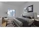 This main bedroom includes bright windows, an attached seating area, and modern decor at 251 S Green Valley Pkwy # 1212, Henderson, NV 89012