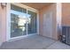 Private patio area with sliding glass doors and outdoor access at 251 S Green Valley Pkwy # 1212, Henderson, NV 89012