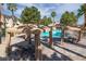 Community pool with covered cabanas and lounge chairs provides ample space to relax in the desert sun at 251 S Green Valley Pkwy # 1212, Henderson, NV 89012