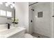 Modern bathroom with white marble shower and black fixtures at 257 Colleen Dr, Las Vegas, NV 89107