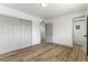 Bright bedroom with light grey closet doors and wood-look flooring at 257 Colleen Dr, Las Vegas, NV 89107