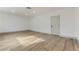 Spacious bedroom with wood-look floors and light gray door at 257 Colleen Dr, Las Vegas, NV 89107