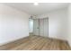 Bedroom with double door closet and wood-look floors at 257 Colleen Dr, Las Vegas, NV 89107