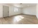 Bright living room with light gray door and wood-look flooring at 257 Colleen Dr, Las Vegas, NV 89107