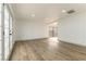 Living room with hardwood floors and sliding glass doors leading outside at 257 Colleen Dr, Las Vegas, NV 89107