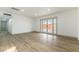 Spacious living room featuring new wood-look floors and access to the backyard at 257 Colleen Dr, Las Vegas, NV 89107