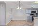 Dining area with modern light fixture and kitchen at 2615 W Gary Ave # 1035, Las Vegas, NV 89123