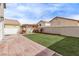 Artificial turf, patio, and pergola in this backyard at 2730 Morning Break Ct, Las Vegas, NV 89142