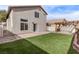 Landscaped backyard with pergola, patio, and artificial turf at 2730 Morning Break Ct, Las Vegas, NV 89142