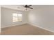 Bright bedroom with carpeted floor, ceiling fan, and window coverings at 2730 Morning Break Ct, Las Vegas, NV 89142