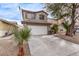 Two-story house with attached garage and desert landscaping at 2730 Morning Break Ct, Las Vegas, NV 89142