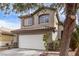 Two-story house with attached garage and landscaping at 2730 Morning Break Ct, Las Vegas, NV 89142