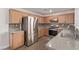 Kitchen with stainless steel appliances and wood cabinets at 2730 Morning Break Ct, Las Vegas, NV 89142