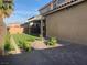 Landscaped backyard with artificial turf and pergola at 2821 White Peaks Ave, North Las Vegas, NV 89081