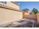 Backyard area featuring concrete pavers and rock landscaping at 2821 White Peaks Ave, North Las Vegas, NV 89081