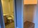 Bright bathroom featuring a toilet and bathtub with tile walls at 2821 White Peaks Ave, North Las Vegas, NV 89081