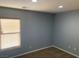 Bedroom featuring neutral paint, carpet, and a window at 2821 White Peaks Ave, North Las Vegas, NV 89081