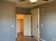 Bedroom featuring a closet, ceiling fan and two doors at 2821 White Peaks Ave, North Las Vegas, NV 89081