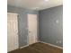Bedroom features a large closet, door and a window at 2821 White Peaks Ave, North Las Vegas, NV 89081