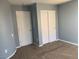 Bedroom featuring two closets with mirrored doors and neutral carpet at 2821 White Peaks Ave, North Las Vegas, NV 89081