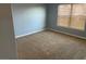 Neutral bedroom featuring carpet and natural light from window at 2821 White Peaks Ave, North Las Vegas, NV 89081