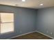 Bright bedroom with a window and neutral-colored walls at 2821 White Peaks Ave, North Las Vegas, NV 89081