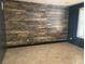 Bonus room with modern accent wall and tile floors at 2821 White Peaks Ave, North Las Vegas, NV 89081