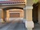 Long covered driveway leads to a spacious two-car garage at 2821 White Peaks Ave, North Las Vegas, NV 89081