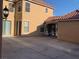 Stucco two-story home featuring a private driveway and tile roof at 2821 White Peaks Ave, North Las Vegas, NV 89081