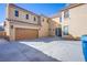 Spacious three-car garage and large backyard concrete area for activities and entertainment at 2821 White Peaks Ave, North Las Vegas, NV 89081