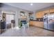 Bright kitchen featuring wood cabinets, tile floor and a cozy fireplace, perfect for Gathering gatherings at 2821 White Peaks Ave, North Las Vegas, NV 89081