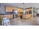 Eat-in kitchen with wooden cabinets, an island, stainless steel appliances, and granite countertops at 2821 White Peaks Ave, North Las Vegas, NV 89081