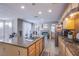 Spacious kitchen with granite countertops, wood cabinets, and stainless steel appliances at 2821 White Peaks Ave, North Las Vegas, NV 89081