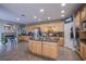 Bright kitchen with granite countertops, stainless steel appliances, and wooden cabinets at 2821 White Peaks Ave, North Las Vegas, NV 89081