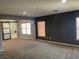 Living room featuring an entryway to the bathrrom, and two windows at 2821 White Peaks Ave, North Las Vegas, NV 89081