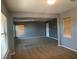 Spacious living room with multiple windows and neutral carpet at 2821 White Peaks Ave, North Las Vegas, NV 89081