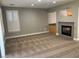 Living room with fireplace, carpet flooring, and large window at 2821 White Peaks Ave, North Las Vegas, NV 89081