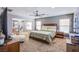 Spacious main bedroom with a ceiling fan, neutral walls, and windows for natural light at 2821 White Peaks Ave, North Las Vegas, NV 89081