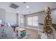 Neutral upstairs playroom features decorative furniture and is illuminated by natural light at 2821 White Peaks Ave, North Las Vegas, NV 89081