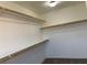 Bright walk-in closet with shelves and room for storage at 2821 White Peaks Ave, North Las Vegas, NV 89081