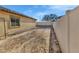 Large backyard with gravel and a privacy fence at 3041 Bublin Bay Ave, North Las Vegas, NV 89081