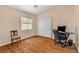 Well-lit bedroom with wood flooring and home office setup at 3041 Bublin Bay Ave, North Las Vegas, NV 89081