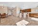 Open concept dining area with tile floors and views into the kitchen at 3041 Bublin Bay Ave, North Las Vegas, NV 89081